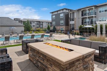 Outdoor fireside lounging area with comfortable seating